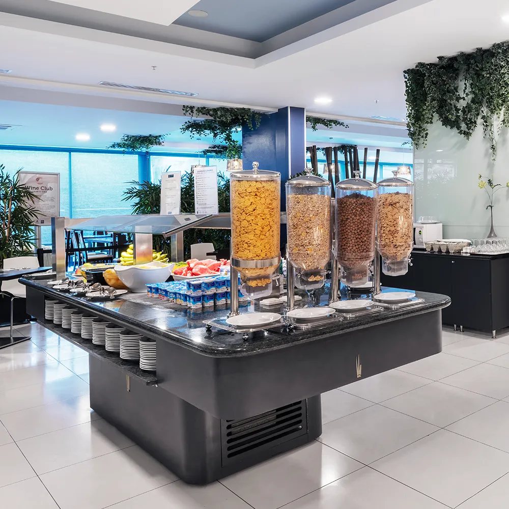 Breakfast buffet with cereals, yoghurts, fresh fruit and other options at the hotel restaurant