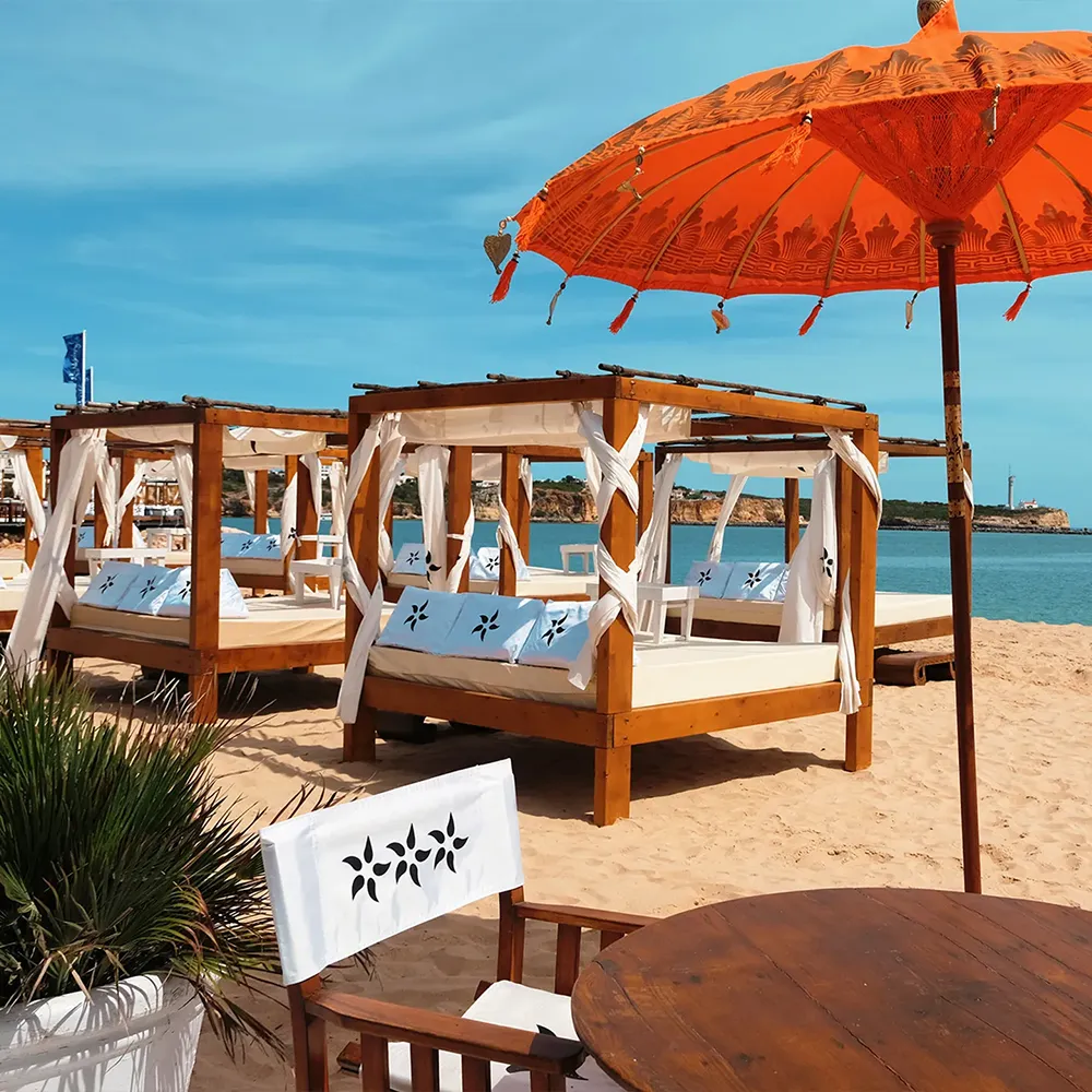 Beachfront Balinese cabanas at NoSoloÁgua Beach Club in Portimão.
