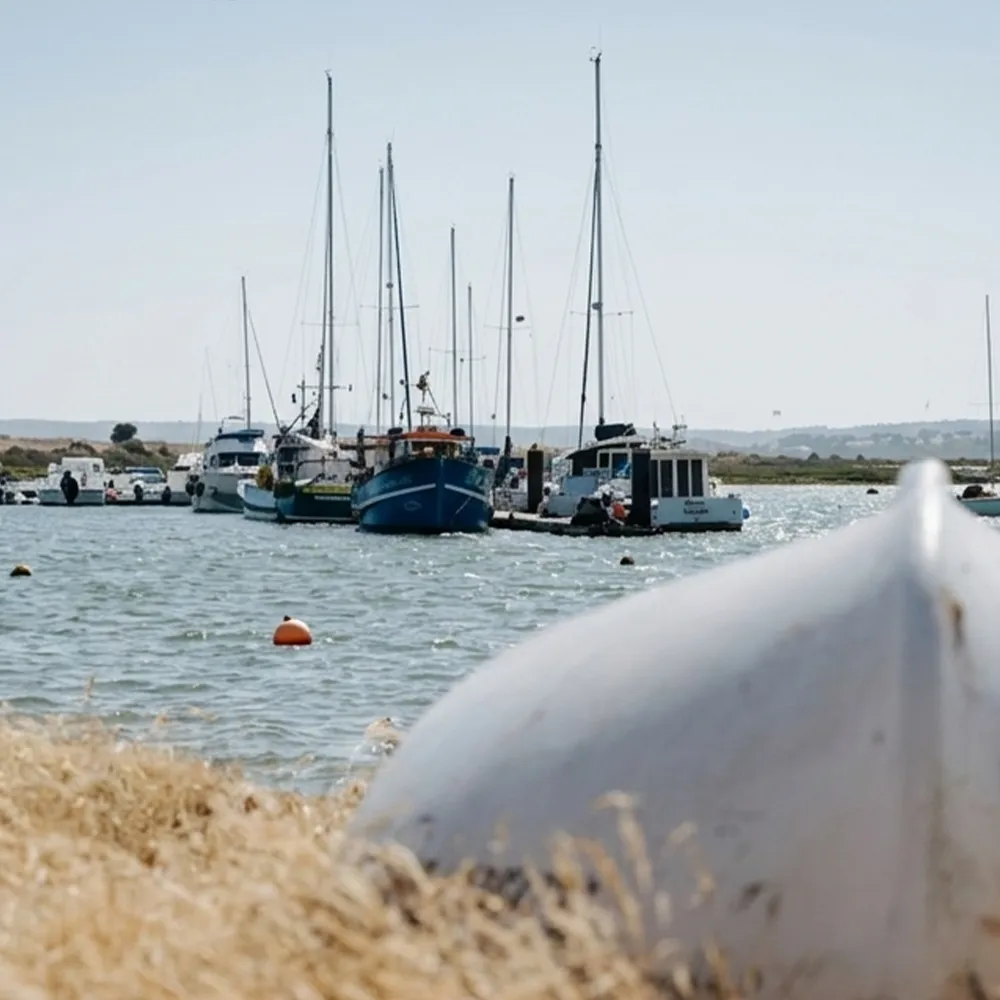 Alvor Ria with boats and vessels along the waterfront.